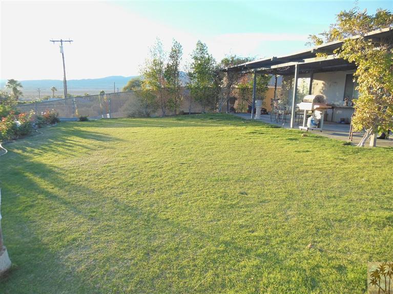 66033 Santa Rosa Road Desert Hot Springs, CA 92240 - Photo 18 of 21 a view of a house with a yard