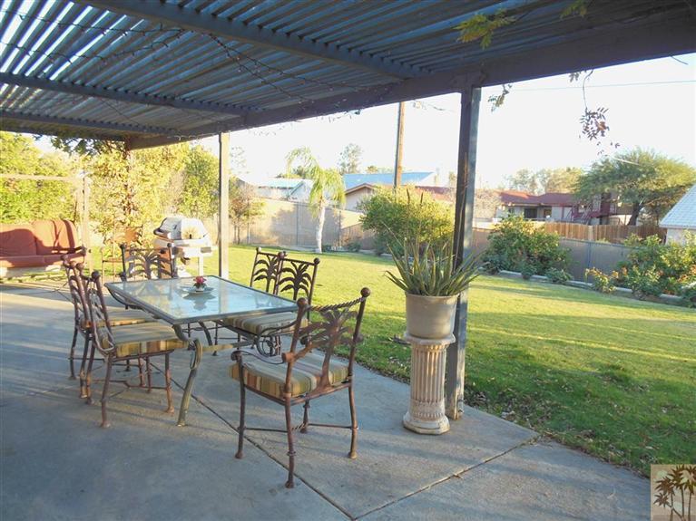 66033 Santa Rosa Road Desert Hot Springs, CA 92240 - Photo 19 of 21 a view of a patio with a table chairs and a table