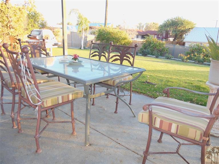 66033 Santa Rosa Road Desert Hot Springs, CA 92240 - Photo 20 of 21 a view of a terrace with dining table and chairs