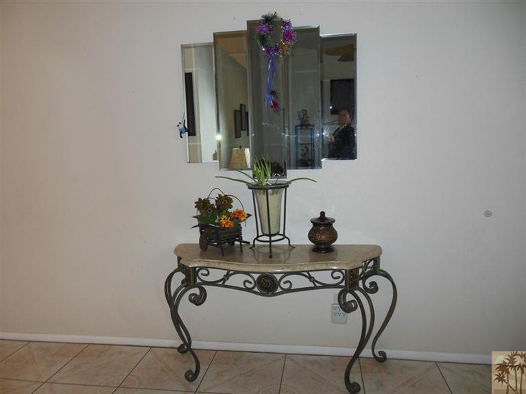 66033 Santa Rosa Road Desert Hot Springs, CA 92240 - Photo 3 of 21 a bathroom with a sink and a mirror