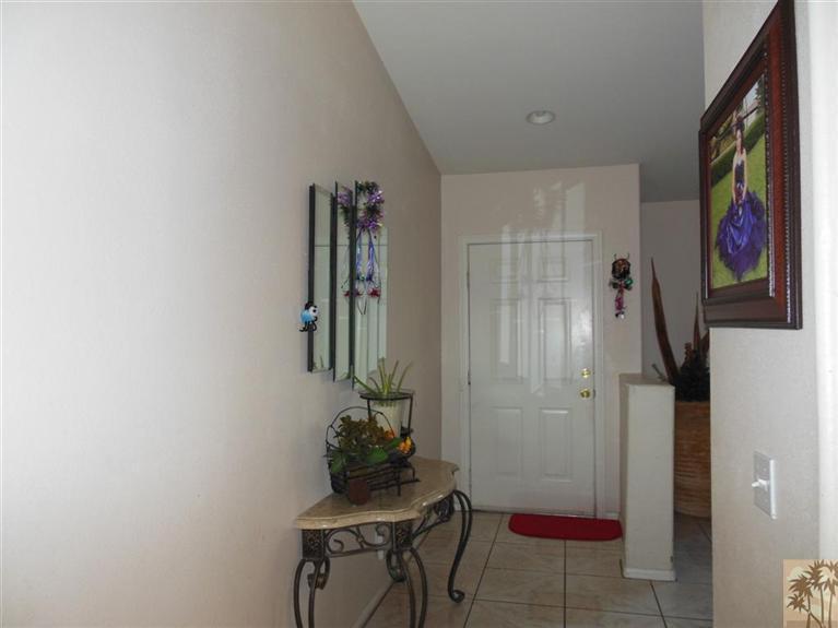 66033 Santa Rosa Road Desert Hot Springs, CA 92240 - Photo 8 of 21 a room with furniture and wall paintings