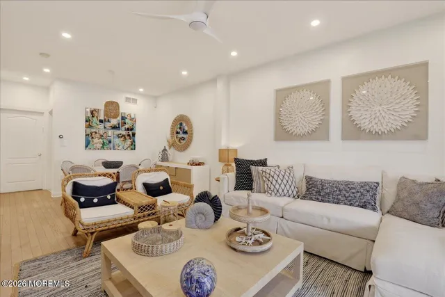 a living room with furniture fireplace and flat screen tv