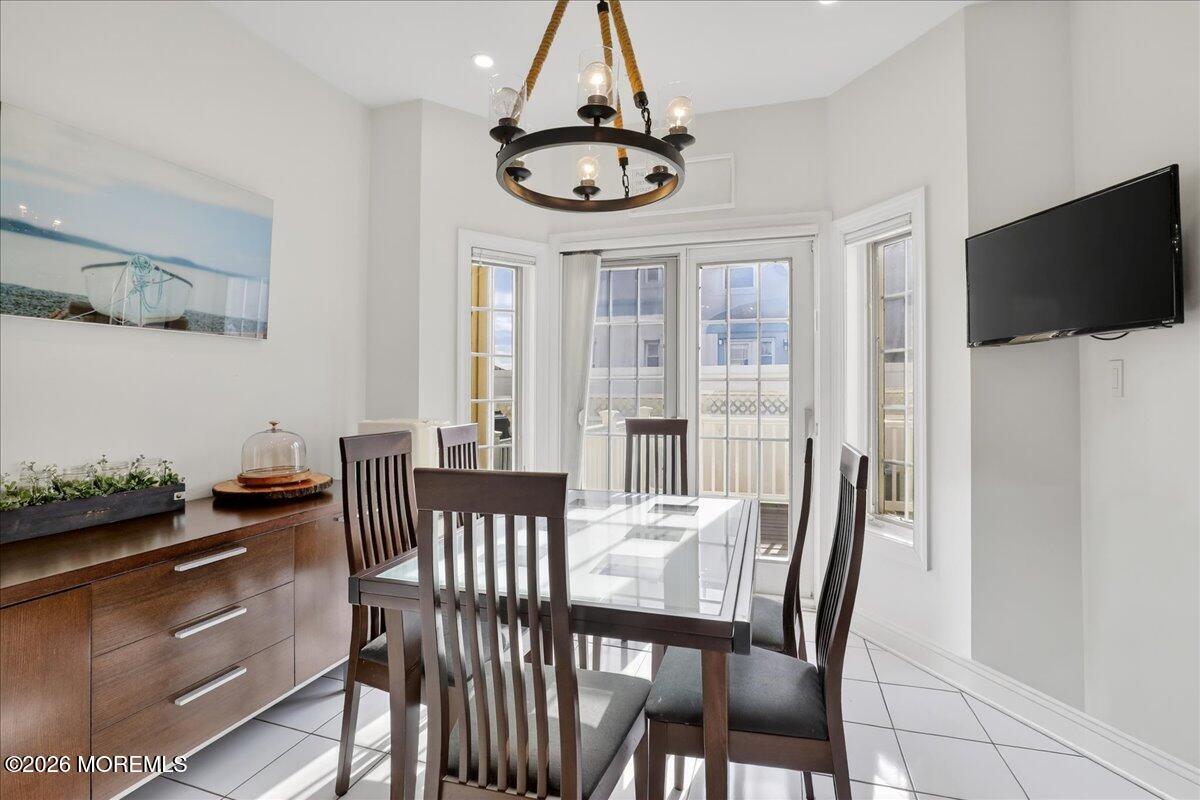 21 Riviera Drive Long Branch, NJ 07740 - Photo 21 of 64 a view of a dining room with furniture window and wooden floor