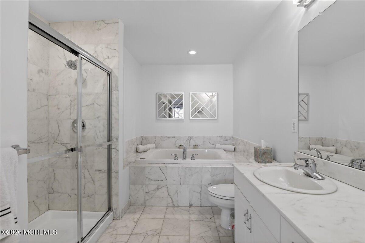 21 Riviera Drive Long Branch, NJ 07740 - Photo 22 of 64 a bathroom with a sink toilet and shower