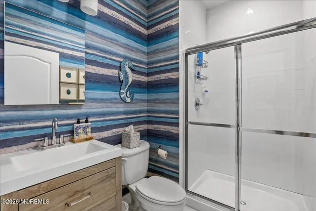 a bedroom with a bed and a table