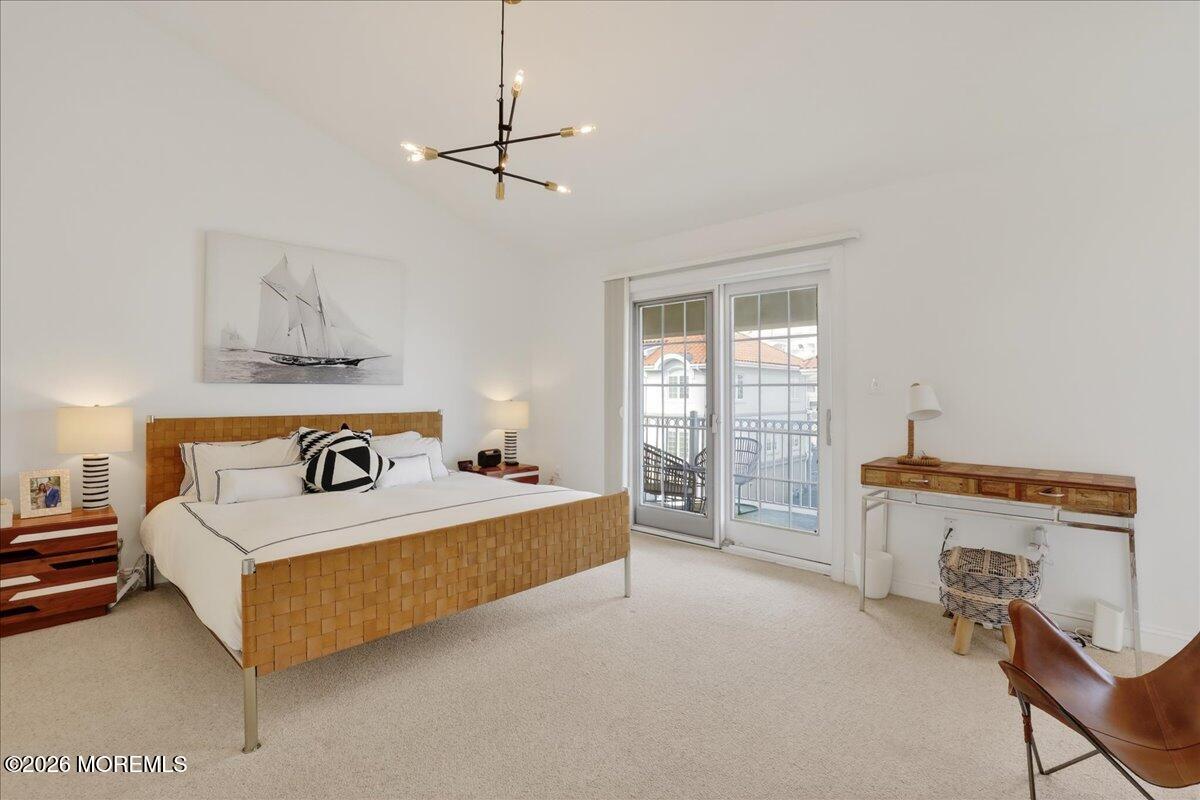 21 Riviera Drive Long Branch, NJ 07740 - Photo 26 of 64 a bedroom with a bed and a table