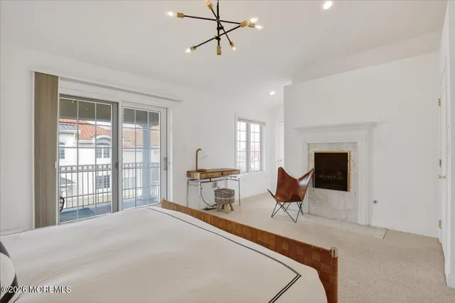 a bedroom with two beds and a large window