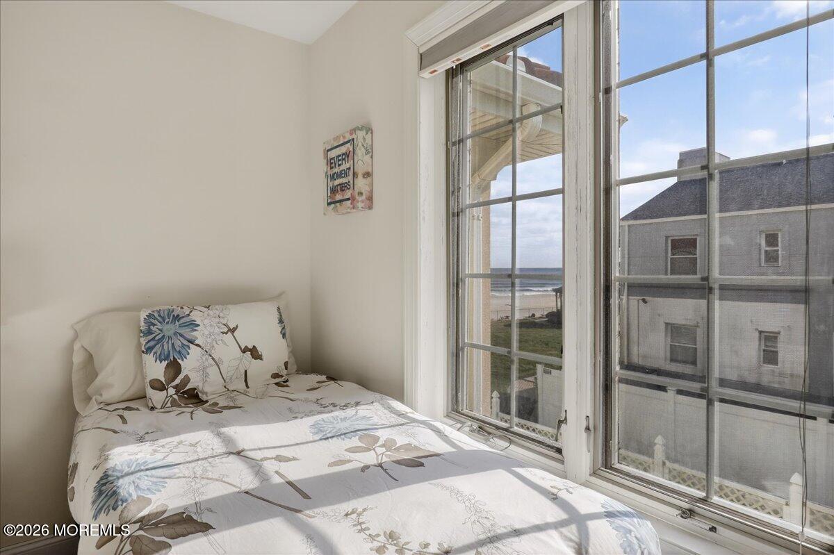 21 Riviera Drive Long Branch, NJ 07740 - Photo 32 of 64 a bedroom with a bed and a window with outer view