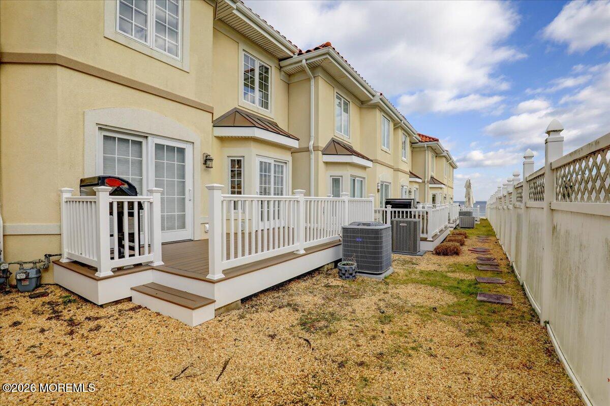 21 Riviera Drive Long Branch, NJ 07740 - Photo 41 of 64 a view of a house with wooden floor roof and wooden fence