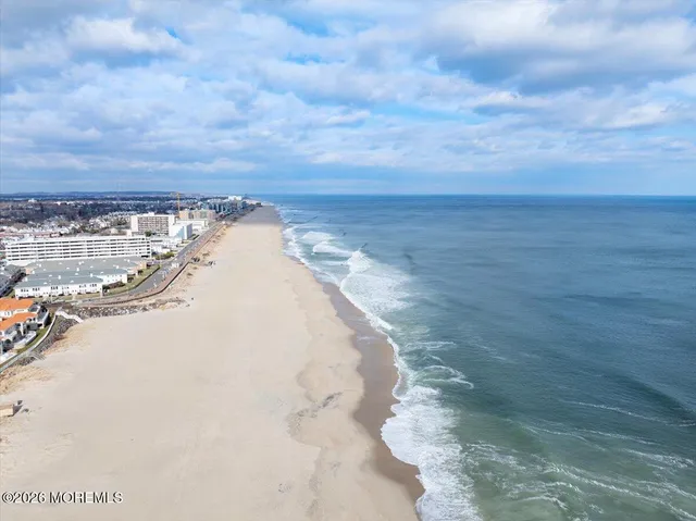 a view of a swimming pool with a table and chairs