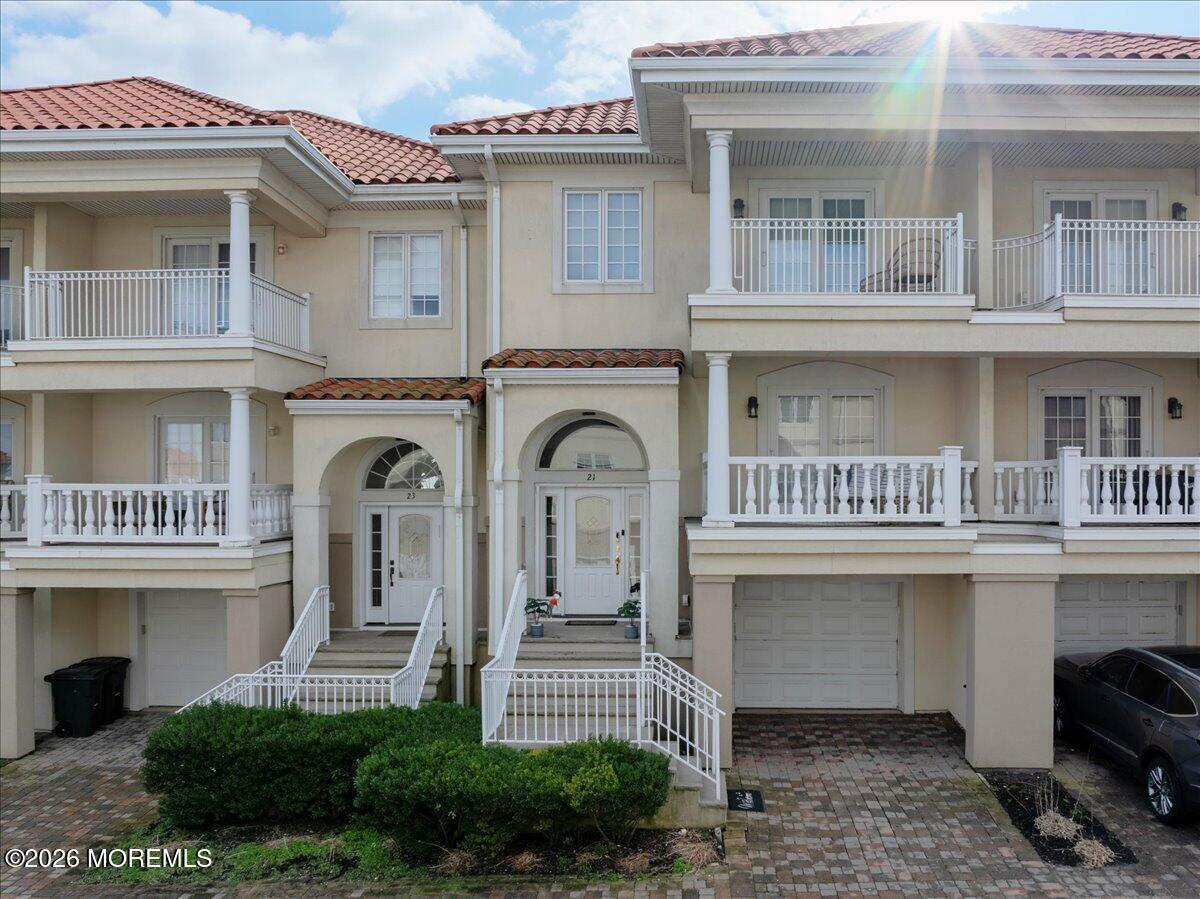 21 Riviera Drive Long Branch, NJ 07740 - Photo 60 of 64 a front view of a house with a garden