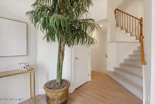 a view of entryway with wooden floor