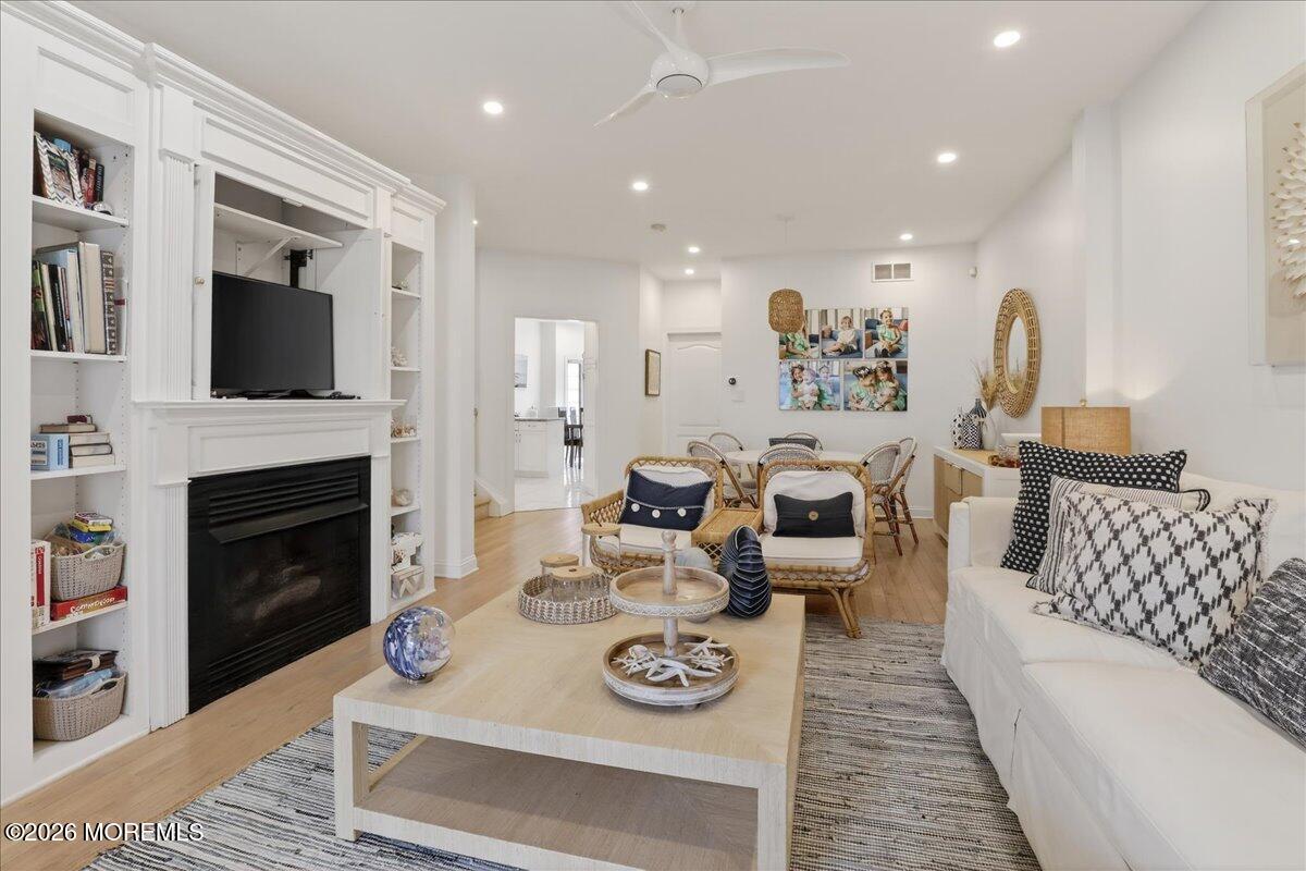 21 Riviera Drive Long Branch, NJ 07740 - Photo 7 of 64 a living room with furniture fireplace and flat screen tv
