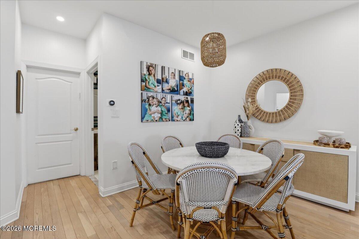 21 Riviera Drive Long Branch, NJ 07740 - Photo 8 of 64 a dining room with furniture and a wooden floor