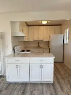 a kitchen with white cabinets