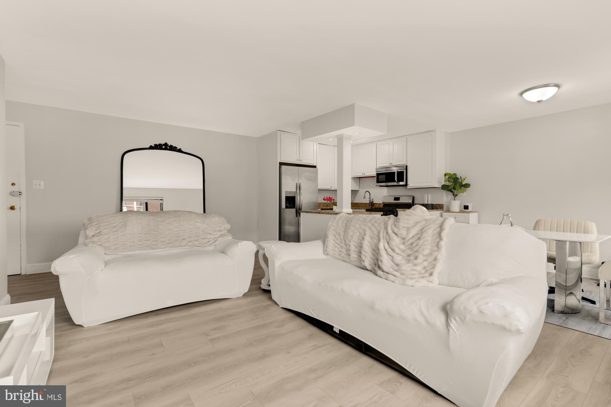 1200 South Arlington Ridge Road, Unit 507 Arlington, VA 22202 - Photo 11 of 30 a bed room with furniture and a mirror