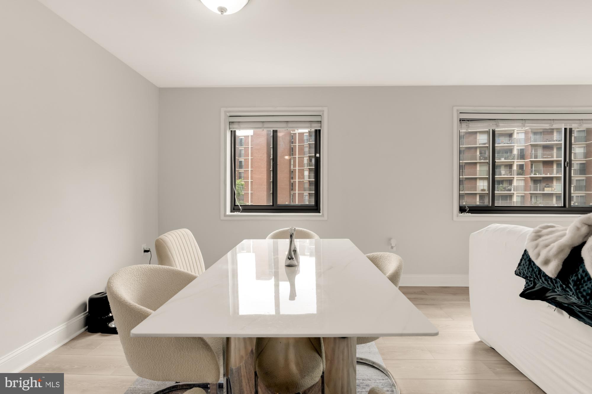 1200 South Arlington Ridge Road, Unit 507 Arlington, VA 22202 - Photo 14 of 30 a view of a dining room with furniture and a window