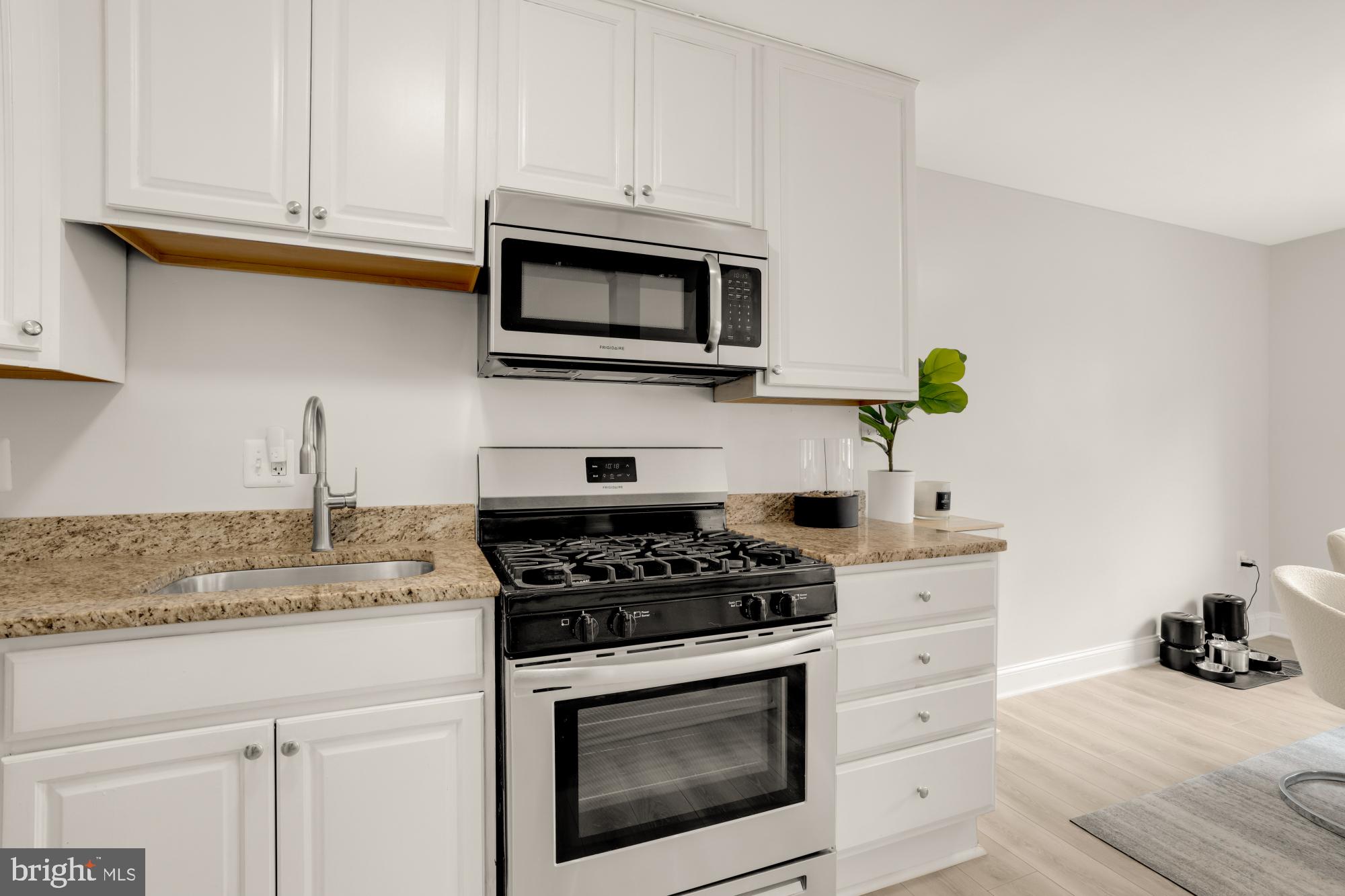 1200 South Arlington Ridge Road, Unit 507 Arlington, VA 22202 - Photo 21 of 30 a kitchen with stainless steel appliances granite countertop white cabinets a stove a sink and dishwasher