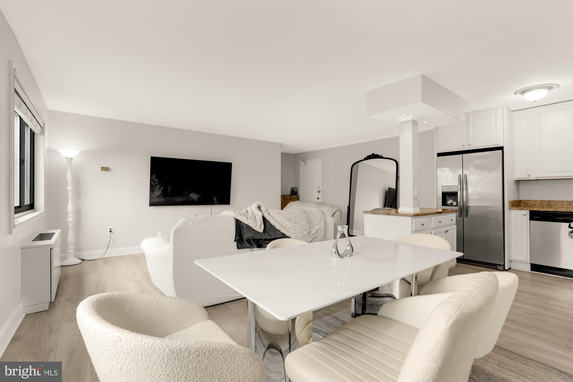 1200 South Arlington Ridge Road, Unit 507 Arlington, VA 22202 - Photo 5 of 30 a view of a dining room with furniture and wooden floor