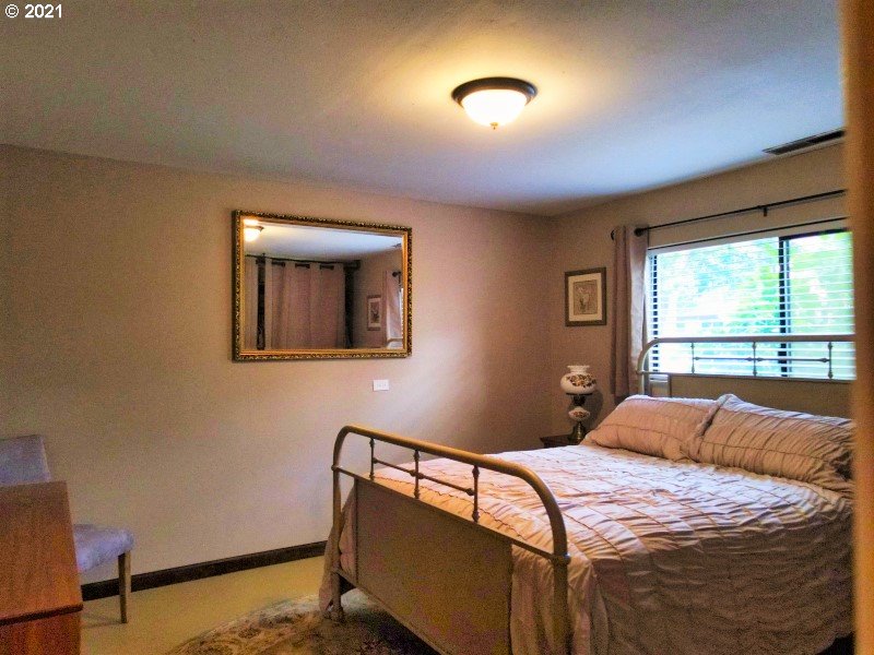 1335 Southwest 41st Street Pendleton, OR 97801 - Photo 13 of 27 a bedroom with a bed and a window
