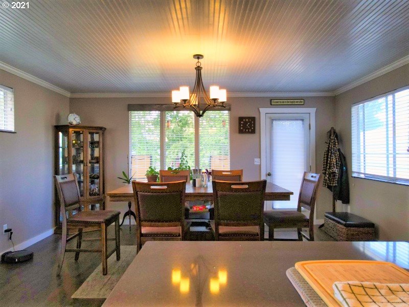 1335 Southwest 41st Street Pendleton, OR 97801 - Photo 5 of 27 a living room with furniture a chandelier and a large window