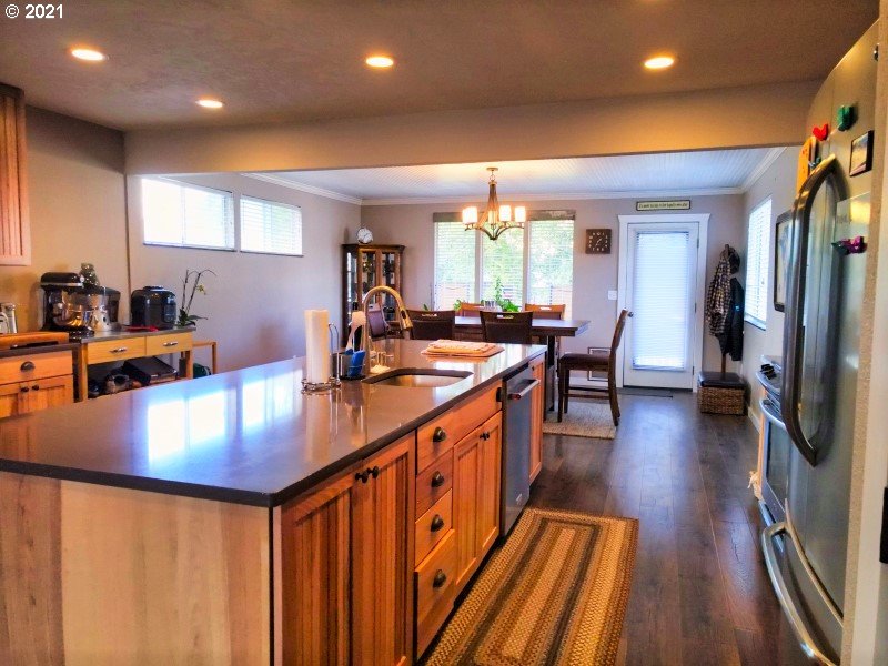 1335 Southwest 41st Street Pendleton, OR 97801 - Photo 7 of 27 a kitchen with counter space dining table and chairs
