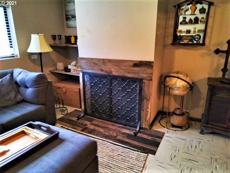 1335 Southwest 41st Street Pendleton, OR 97801 - Photo 9 of 27 a living room with furniture and a fireplace