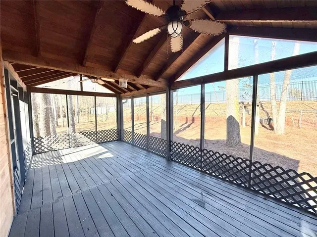 a view of porch with wooden floor