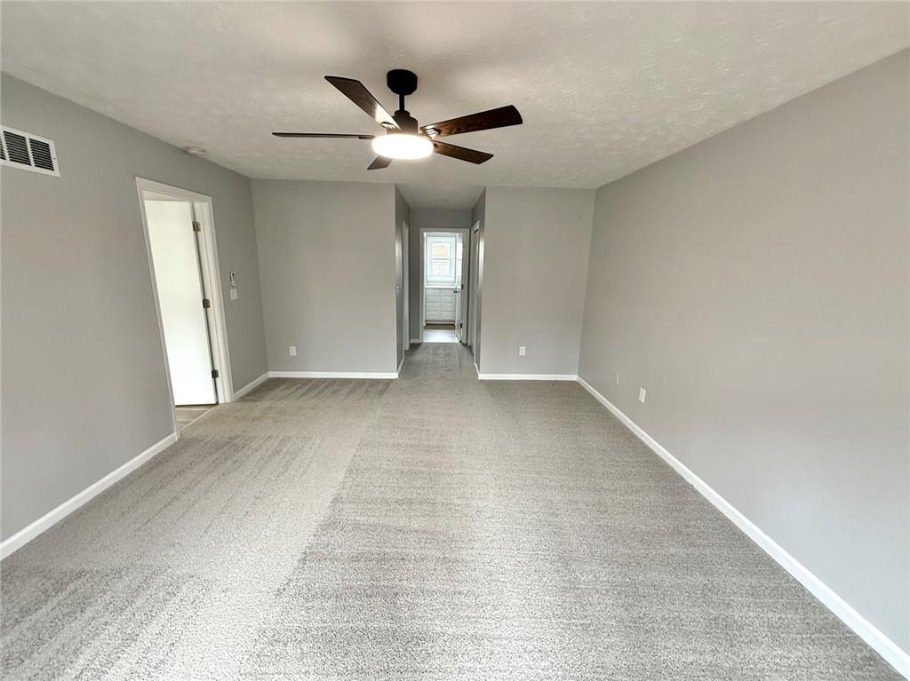 3851 Riding Woods Court Powder Springs, GA 30127 - Photo 19 of 32 wooden floor in an empty room with a window