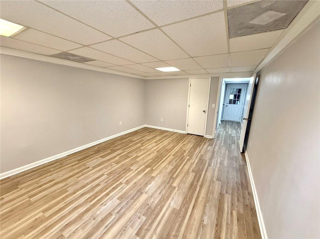 3851 Riding Woods Court Powder Springs, GA 30127 - Photo 26 of 32 a view of a room with wooden floor and entryway