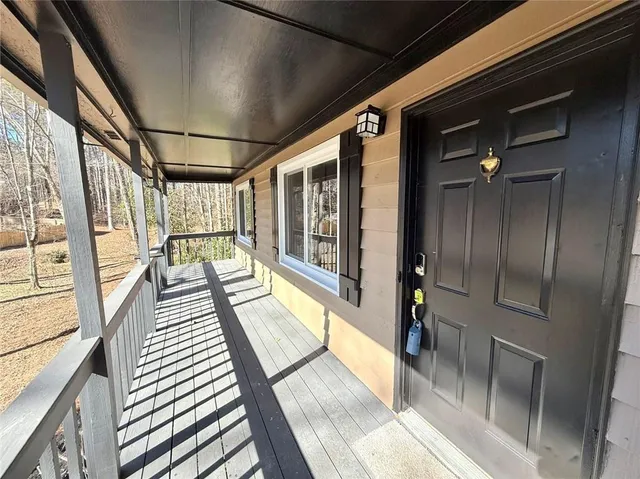 a view of a living room with a large window