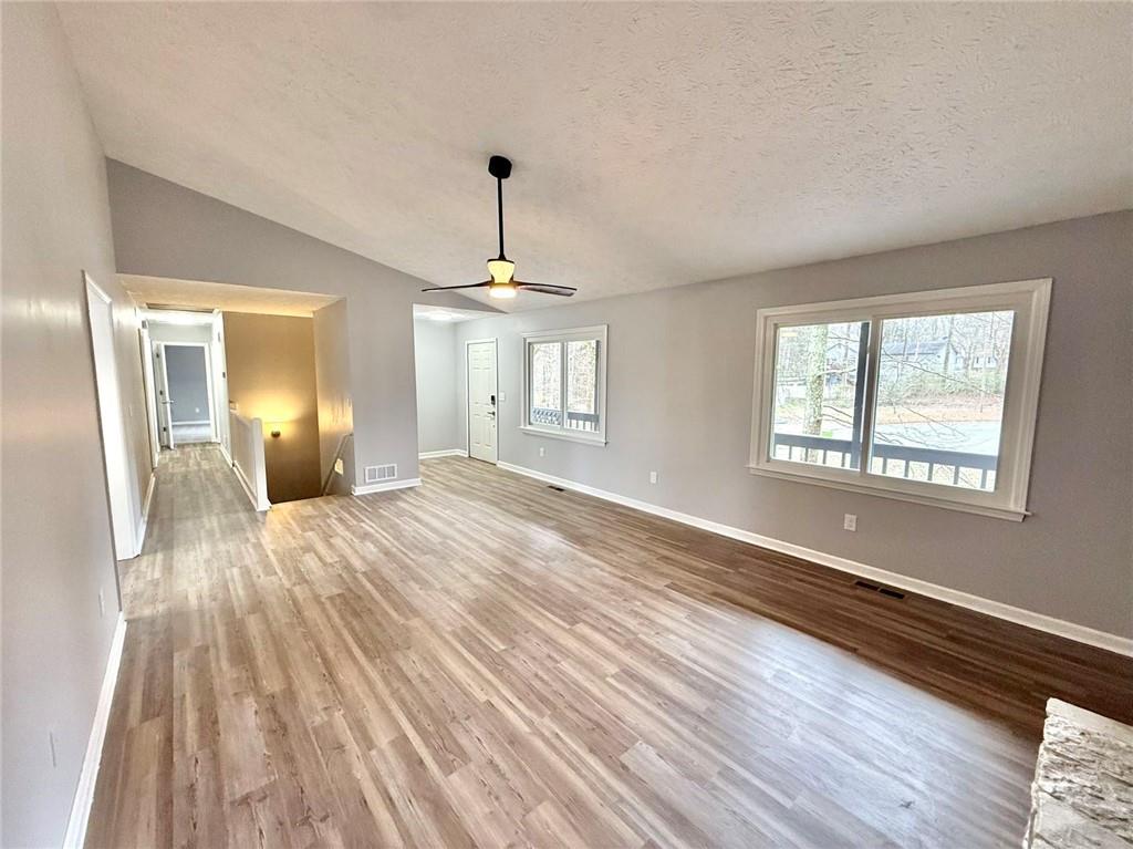 3851 Riding Woods Court Powder Springs, GA 30127 - Photo 7 of 32 a view of empty room with wooden floor