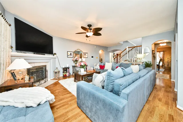 a living room with furniture fireplace and flat screen tv