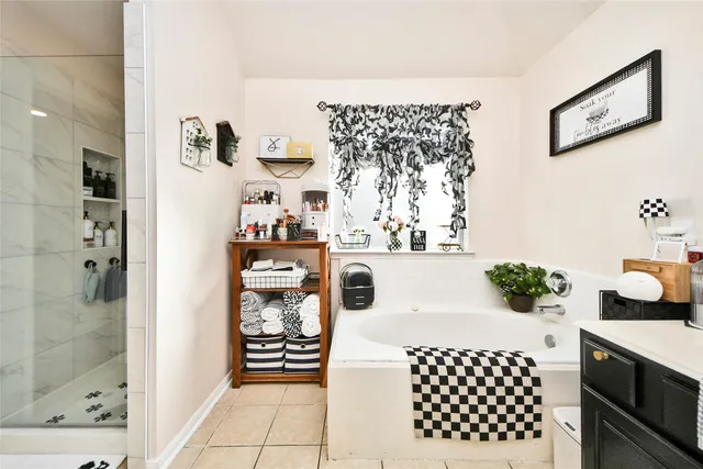 a kitchen with stainless steel appliances kitchen island granite countertop a refrigerator and a stove