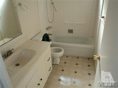 19 Kanan Road Oak Park, CA 91377 - Photo 5 of 12 a bathroom with a sink a toilet and shower