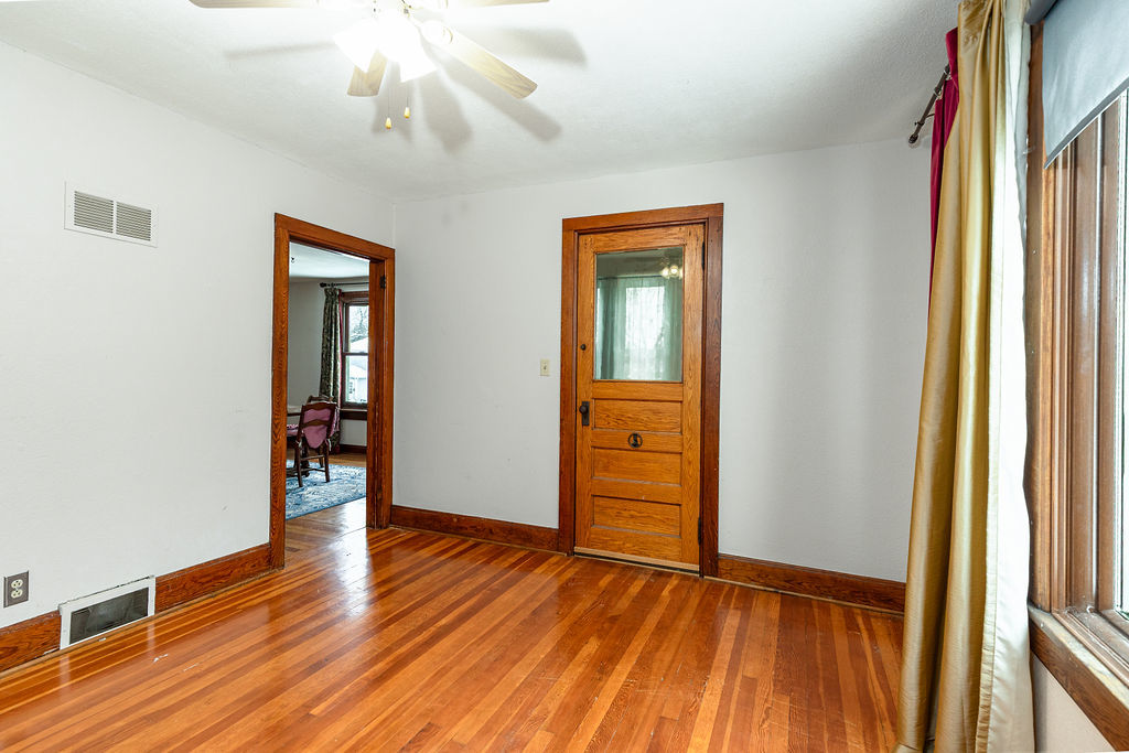 809 Franklin Street Galena, IL 61036 - Photo 7 of 28 wooden floor in an empty room with a window