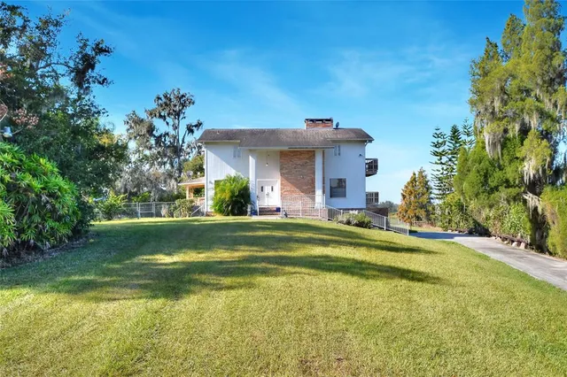 a view of a house with a swimming pool