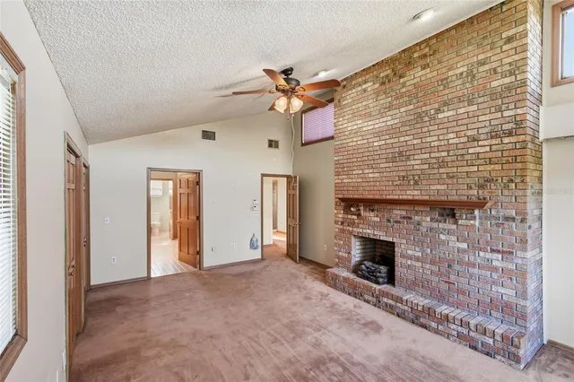 a spacious bathroom with a double vanity sink a mirror and a toilet