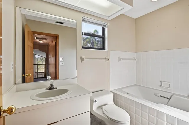 a view of yard with swimming pool and trees