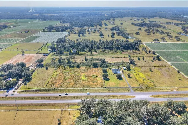 a view of a lake with houses in the background