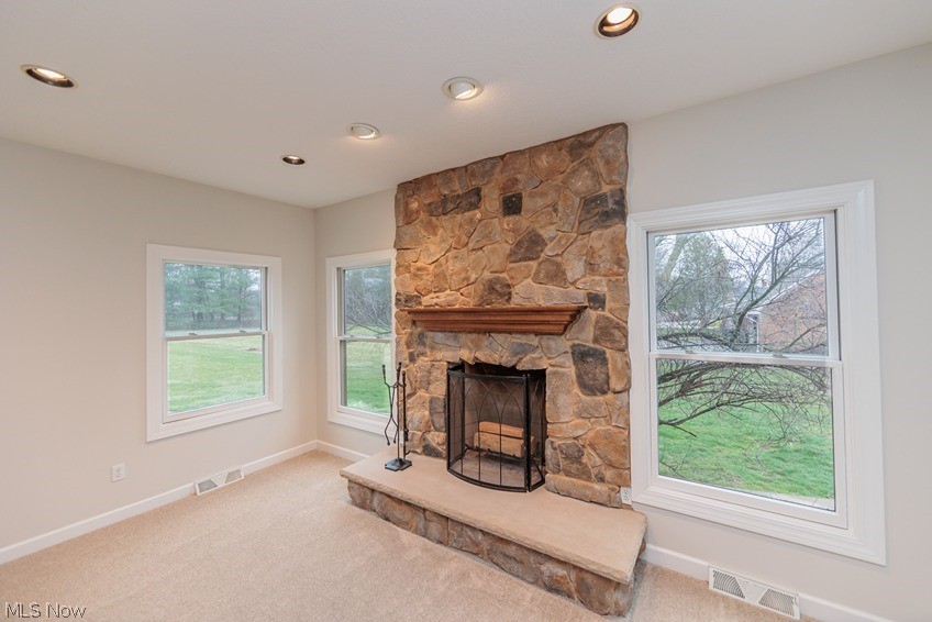 6947 Som Center Road Solon, OH 44139 - Photo 23 of 50 Carpeted living room with a stone fireplace