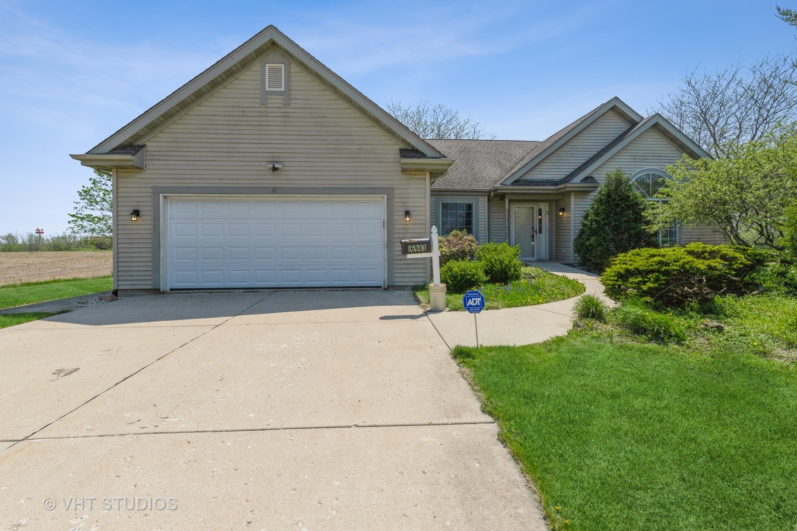 a front view of house with yard and green space