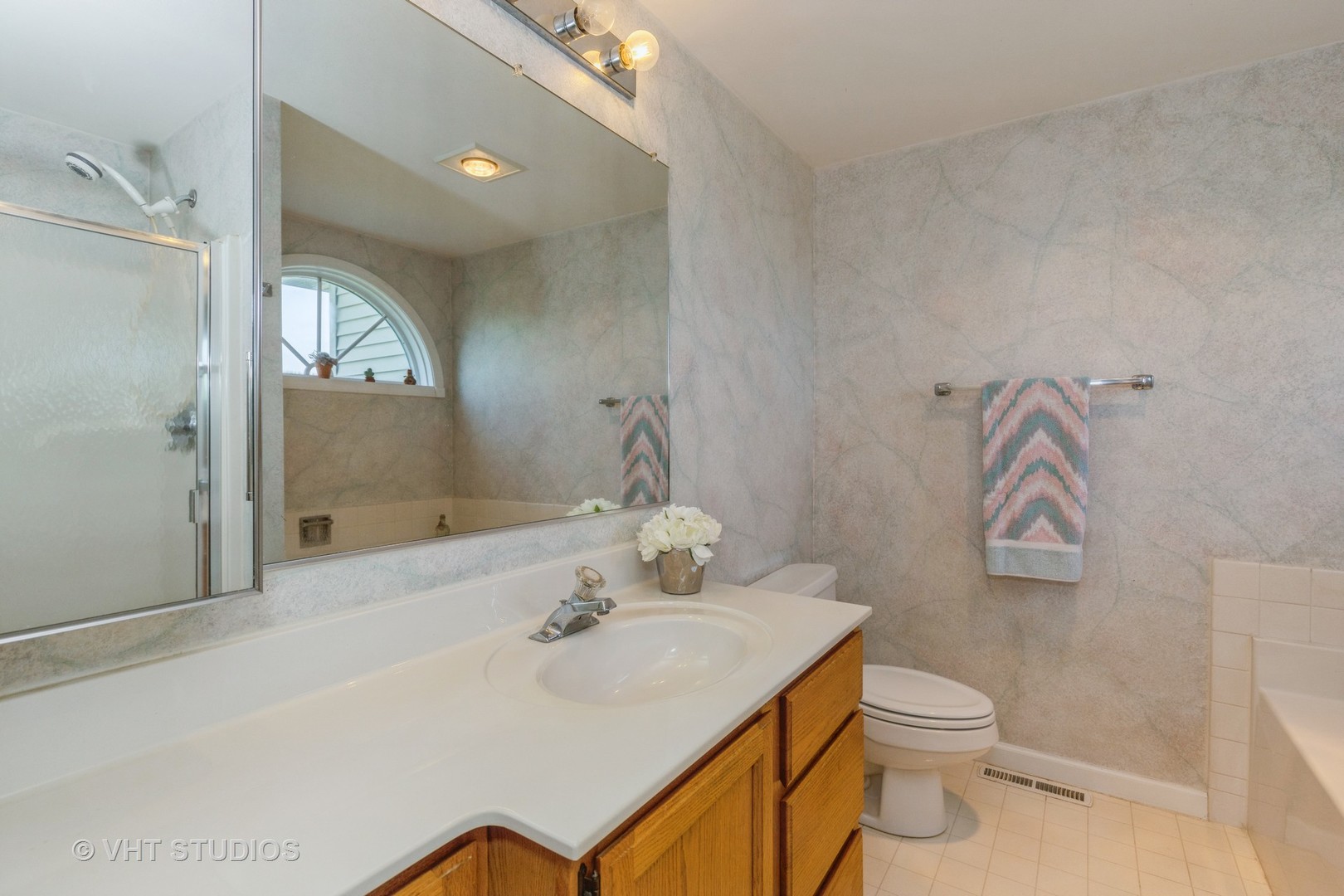 16943 West State Line Road Zion, IL 60099 - Photo 11 of 26 a bathroom with a sink toilet and shower