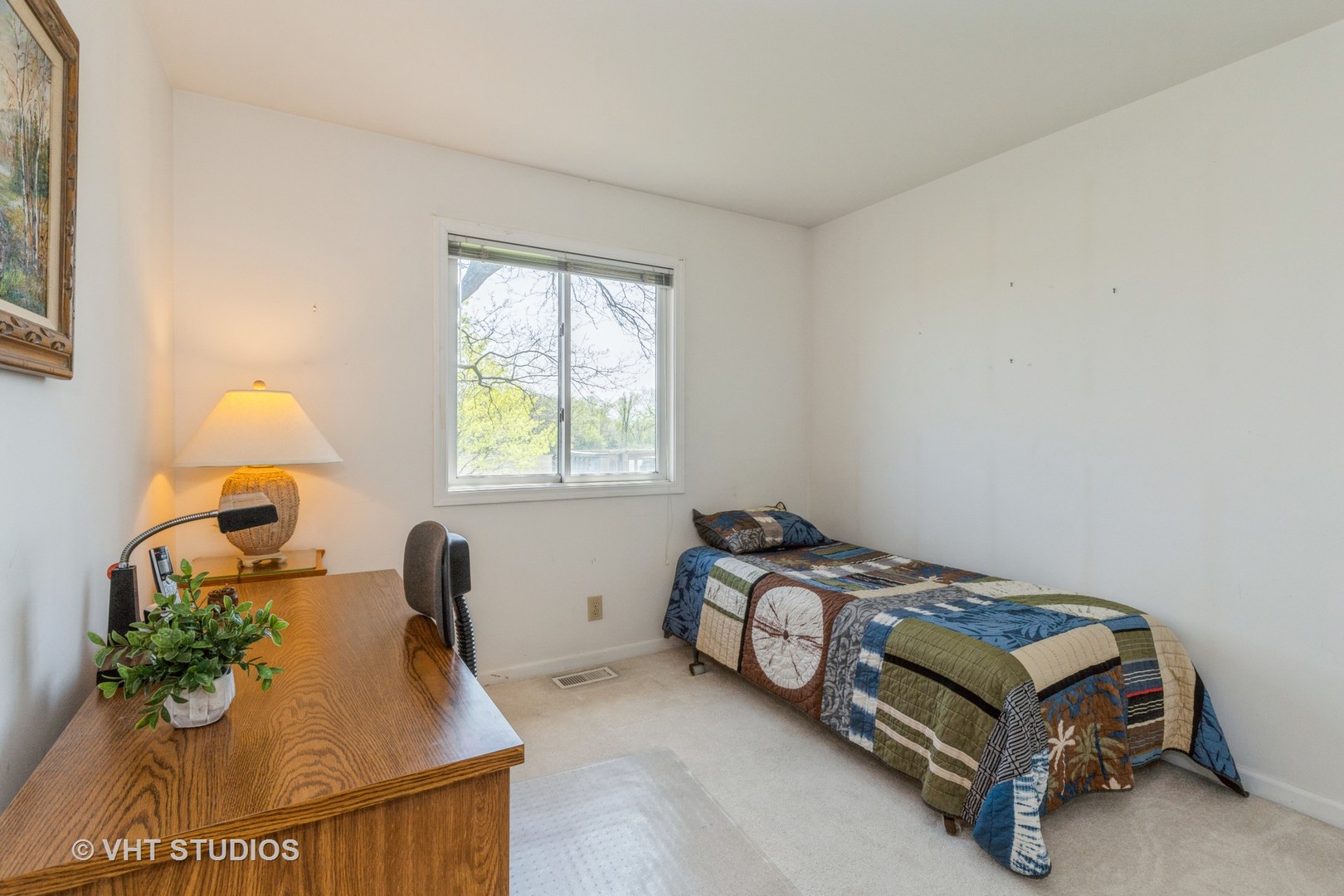 16943 West State Line Road Zion, IL 60099 - Photo 12 of 26 a bedroom with a bed and a window