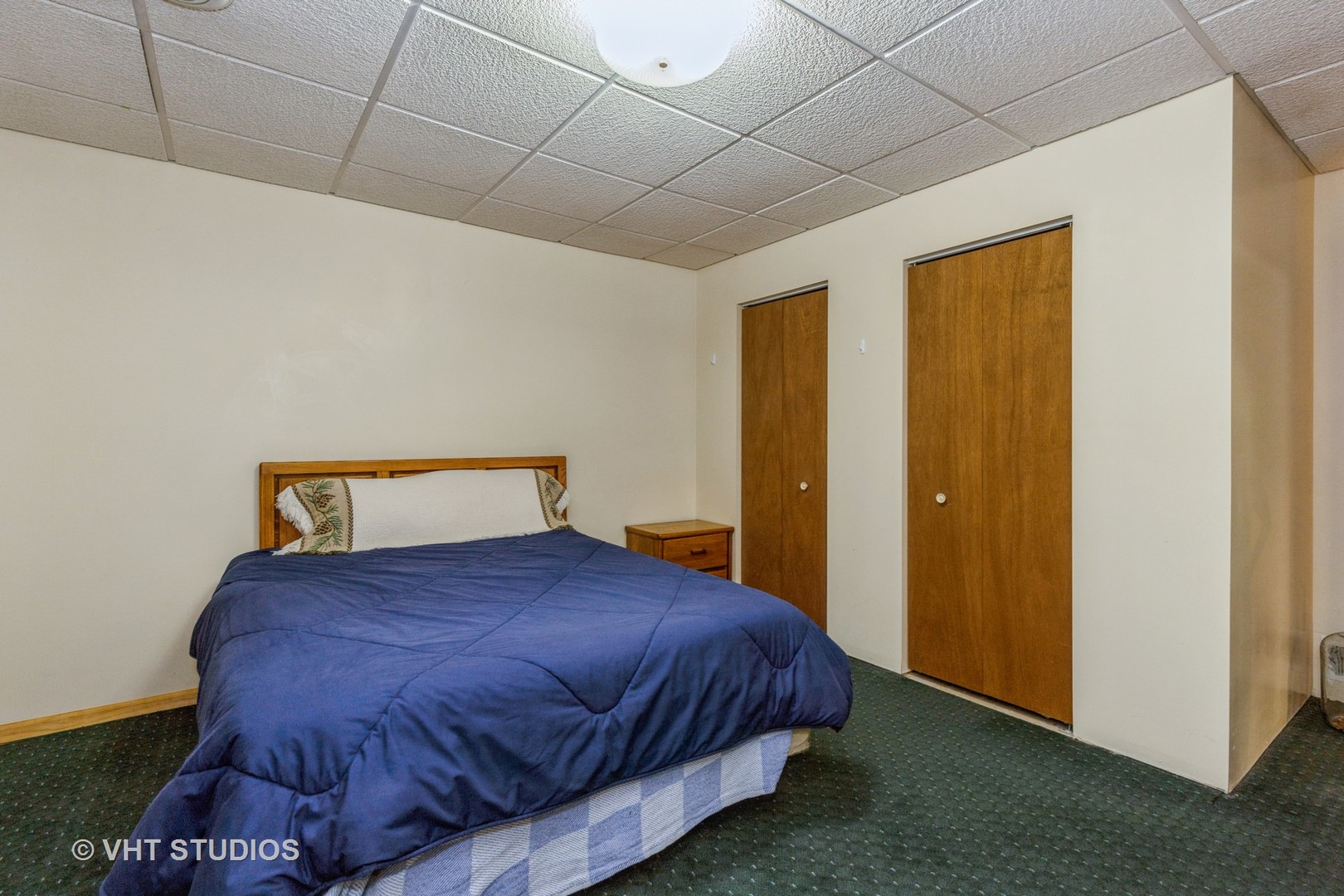 16943 West State Line Road Zion, IL 60099 - Photo 16 of 26 a bedroom with a bed and a night stand