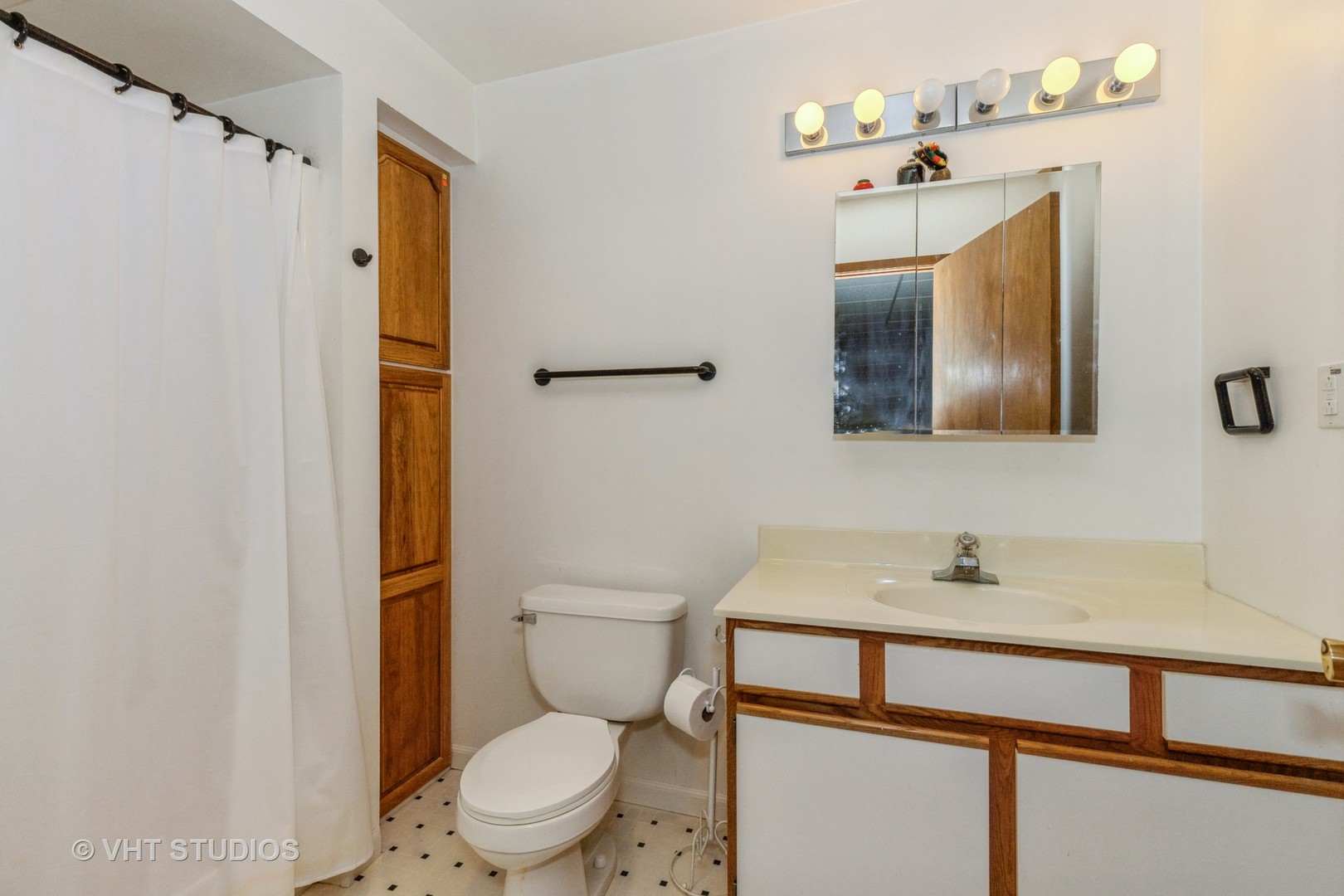 16943 West State Line Road Zion, IL 60099 - Photo 17 of 26 a bathroom with a sink vanity mirror and toilet