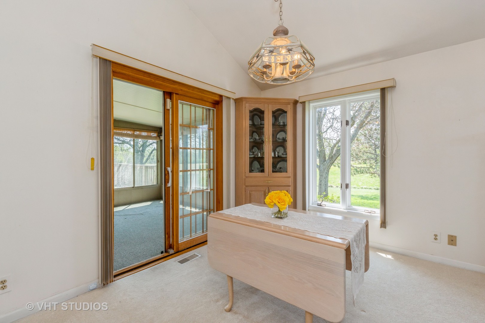 16943 West State Line Road Zion, IL 60099 - Photo 5 of 26 a view of a dining room with a window and chandelier