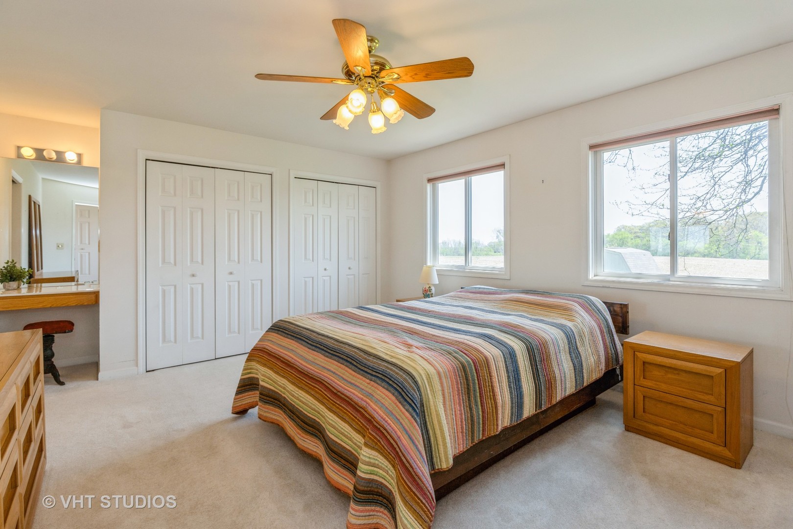 16943 West State Line Road Zion, IL 60099 - Photo 10 of 26 a bedroom with a bed and a chandelier