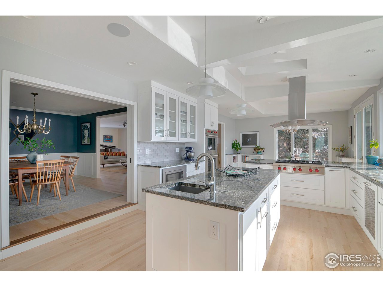 7034 Indian Peaks Trail Boulder, CO 80301 - Photo 15 of 40 a kitchen with kitchen island granite countertop a table and chairs