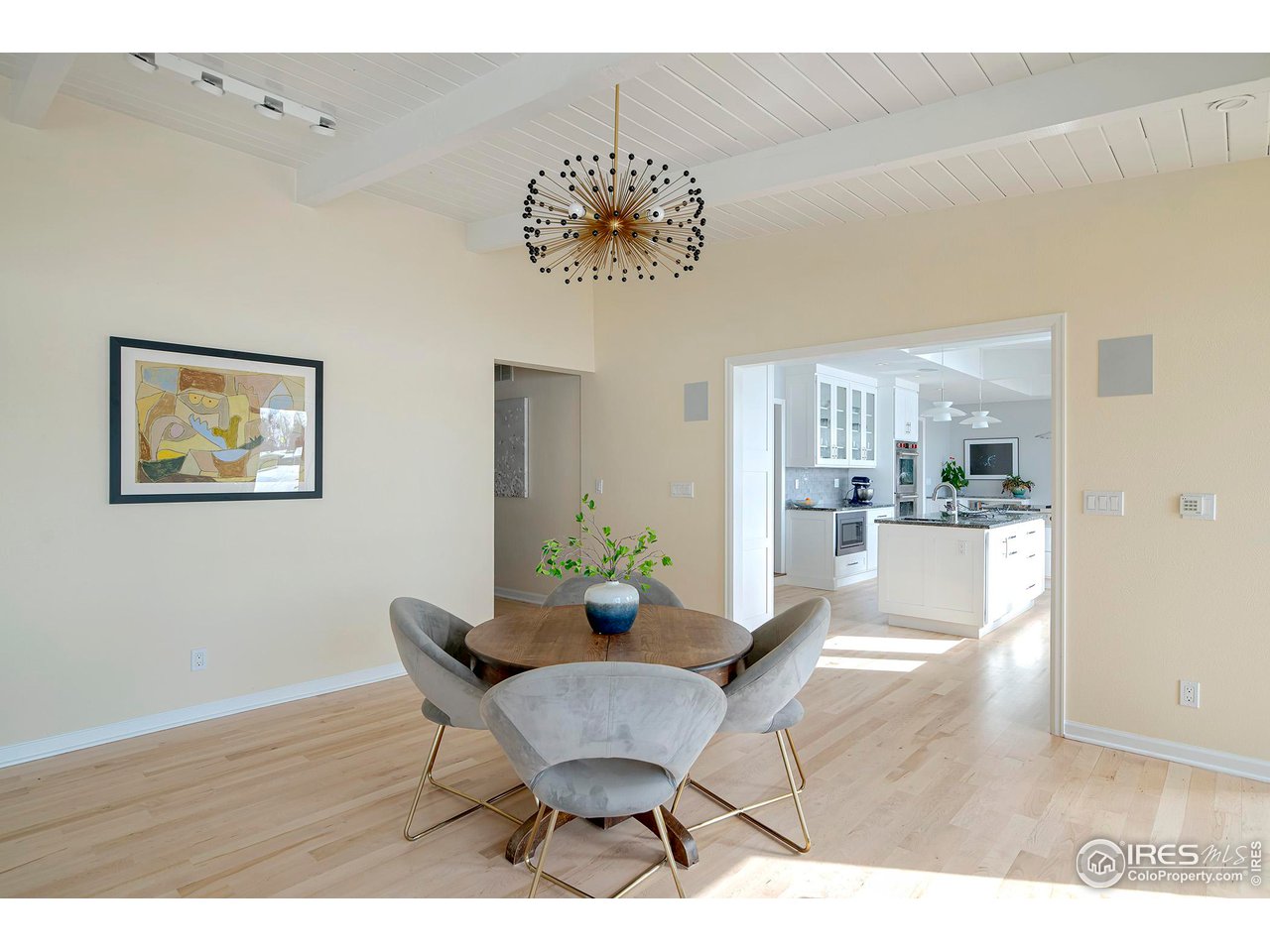 7034 Indian Peaks Trail Boulder, CO 80301 - Photo 17 of 40 a view of a dining room with furniture and wooden floor